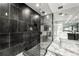 Modern bathroom features a glass walk-in shower and marble floors at 1009 Riverbend Club Se Dr, Atlanta, GA 30339