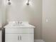 Modern bathroom with white vanity, white countertops and stylish lighting at 1009 Riverbend Club Se Dr, Atlanta, GA 30339