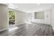 Bedroom with storage units, a large window, and wooden floors at 1009 Riverbend Club Se Dr, Atlanta, GA 30339