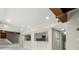 Open living space with a peek-through to the kitchen and stairs, with recessed lighting at 1009 Riverbend Club Se Dr, Atlanta, GA 30339