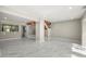 Open living room features stairs to a second floor and a marble-like floor at 1009 Riverbend Club Se Dr, Atlanta, GA 30339