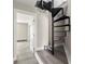 View of a home's interior showing a metal spiral staircase at 1009 Riverbend Club Se Dr, Atlanta, GA 30339