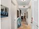 Entrance hallway with tile floors, light walls, and decoratively appointed side table at 5180 Chemin De Vie, Atlanta, GA 30342