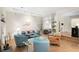 Living room features light walls, light floors, fireplace and glass shelving at 5180 Chemin De Vie, Atlanta, GA 30342