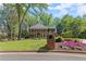 Beautiful brick home with lush lawn, flowering plants, and a classic mailbox at 5790 Heards Forest Dr, Atlanta, GA 30328
