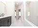 Bright bathroom with white walls, gray vanity, and a glass-enclosed shower at 255 Briscoe Way # 5, Alpharetta, GA 30009