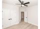 Bedroom with hardwood floors, ceiling fan, and a double-door closet at 255 Briscoe Way # 5, Alpharetta, GA 30009