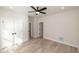 Bedroom with hardwood floors, a ceiling fan, and a double-door closet at 255 Briscoe Way # 5, Alpharetta, GA 30009