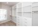 Spacious walk-in closet with custom shelving and drawers at 255 Briscoe Way # 5, Alpharetta, GA 30009