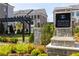 A stylish community entrance with manicured landscaping and architectural signage welcomes residents and guests alike at 255 Briscoe Way # 5, Alpharetta, GA 30009