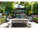 A cozy outdoor seating area with a fire pit and Jeni's Ice Creams offers a perfect community gathering spot at 255 Briscoe Way # 5, Alpharetta, GA 30009