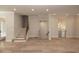 Well-lit hallway features hardwood floors, a staircase, and access to other rooms in the house at 255 Briscoe Way # 5, Alpharetta, GA 30009