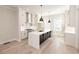 Modern white kitchen with stainless steel appliances and a large island at 255 Briscoe Way # 5, Alpharetta, GA 30009