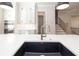 Eat-in kitchen featuring stainless steel appliances, center island, and custom cabinets at 255 Briscoe Way # 5, Alpharetta, GA 30009