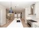 Gourmet kitchen with stainless steel appliances, island, and hardwood floors throughout at 255 Briscoe Way # 5, Alpharetta, GA 30009