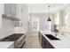 Eat-in kitchen featuring stainless steel appliances, center island, and abundant cabinet space at 255 Briscoe Way # 5, Alpharetta, GA 30009