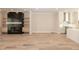 Open floorplan featuring a modern fireplace, hardwood floors and white kitchen at 255 Briscoe Way # 5, Alpharetta, GA 30009