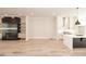 Bright, open living space featuring hardwood floors, modern fixtures and fireplace at 255 Briscoe Way # 5, Alpharetta, GA 30009