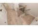 Hallway features a staircase with hardwood floors and wrought iron railing, with access to multiple rooms at 255 Briscoe Way # 5, Alpharetta, GA 30009