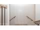 Stairwell with wood handrails and white wood paneled walls at 255 Briscoe Way # 5, Alpharetta, GA 30009