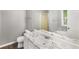 Bathroom featuring a vanity with granite countertop, bathtub, shower and natural light at 402 Leslie Ct, Mcdonough, GA 30253