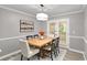 Dining room featuring a table and chairs, modern light fixture, and french doors at 402 Leslie Ct, Mcdonough, GA 30253