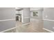 Open concept living room view into kitchen with light grey walls at 402 Leslie Ct, Mcdonough, GA 30253