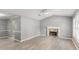 Spacious living room with light grey walls and a stone fireplace at 402 Leslie Ct, Mcdonough, GA 30253