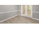 Living area with double doors providing access to the outside and light walls at 402 Leslie Ct, Mcdonough, GA 30253
