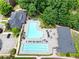 Aerial view showcasing the community pool, sun deck, and clubhouse amenities at 4201 Village Green Dr, Roswell, GA 30075
