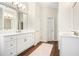 Bright bathroom with double vanities, and white cabinets at 4201 Village Green Dr, Roswell, GA 30075