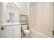 Standard bathroom with a single vanity, toilet, and shower/tub combination at 4201 Village Green Dr, Roswell, GA 30075