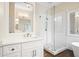 Bright bathroom featuring glass enclosed shower and white vanity with quartz countertop at 4201 Village Green Dr, Roswell, GA 30075