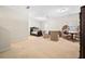 Spacious bedroom featuring neutral color scheme, ceiling fan, and two sitting chairs at 4201 Village Green Dr, Roswell, GA 30075