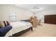 Spacious bedroom featuring neutral color scheme, and two sitting chairs at 4201 Village Green Dr, Roswell, GA 30075