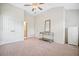 Bedroom featuring neutral walls, carpet, ceiling fan, and dresser at 4201 Village Green Dr, Roswell, GA 30075