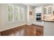 Eat-in kitchen features custom cabinetry, stainless steel appliances, and lots of natural light from a large window at 4201 Village Green Dr, Roswell, GA 30075
