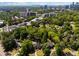 Aerial view of a neighborhood with mature trees and city skyline in the distance at 1059 Abington Ct, Brookhaven, GA 30319