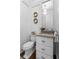 Elegant powder room featuring granite countertop and modern fixtures at 1059 Abington Ct, Brookhaven, GA 30319