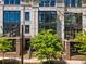 Charming townhome featuring a brick facade, outdoor seating area, and beautifully manicured landscaping at 1059 Abington Ct, Brookhaven, GA 30319