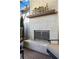 Close-up of the painted brick fireplace on the outdoor patio, and gas logs at 1059 Abington Ct, Brookhaven, GA 30319