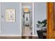 Hallway leads to the ensuite bath with an adjacent armoire in the main bedroom at 1059 Abington Ct, Brookhaven, GA 30319