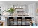 Stylish kitchen with modern white cabinetry and a central island with bar stools at 1059 Abington Ct, Brookhaven, GA 30319