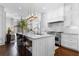 Gourmet kitchen featuring a large island, stainless steel appliances, and an adjacent living area at 1059 Abington Ct, Brookhaven, GA 30319