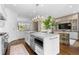 Open kitchen featuring a large island, stainless appliances, and hardwood floors at 1059 Abington Ct, Brookhaven, GA 30319