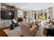 Bright living room featuring a brick fireplace, built-in shelving, and large windows at 1059 Abington Ct, Brookhaven, GA 30319