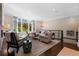 Spacious living room with modern furnishings, hardwood floors, and access to an outdoor balcony at 1059 Abington Ct, Brookhaven, GA 30319