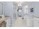 The luxurious main bathroom features double vanities, a glass shower, and a soaking tub at 1059 Abington Ct, Brookhaven, GA 30319