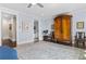 Large main bedroom featuring dark wood floors, an armoire, and an ensuite bath at 1059 Abington Ct, Brookhaven, GA 30319