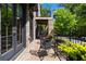Outdoor covered porch has beautiful wrought iron furniture and brick pavers at 1059 Abington Ct, Brookhaven, GA 30319